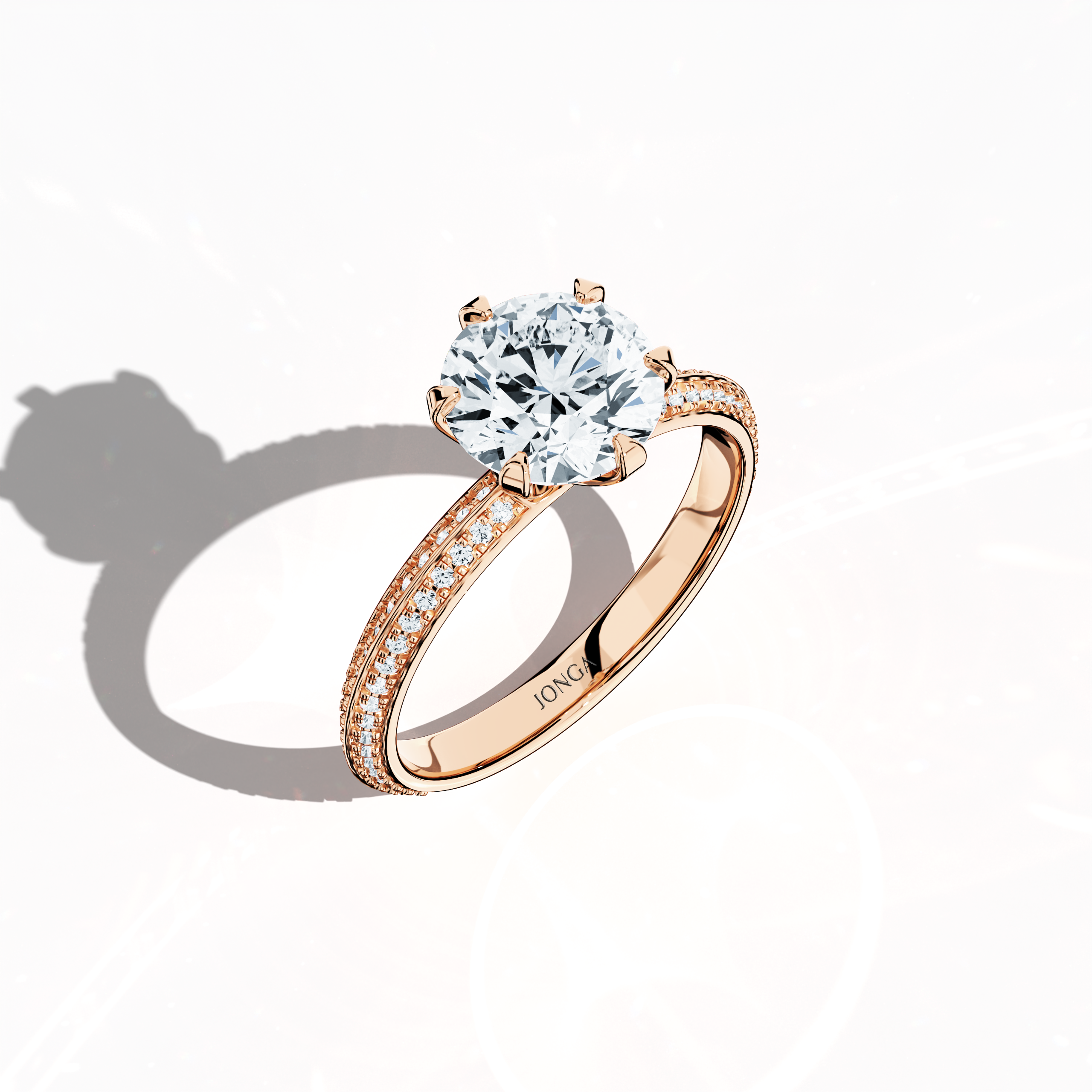 Modern 2.40 ct solitaire paved ring featuring a 2 ct center diamond and 0.40 ct pavé side stones, set in soft rose gold (blush/pink gold) with a dual‑tier, step‑designed band and a defined central line. Captured from a front top side angle, this fine jewelry/fine jewellery ring emphasizes its intricate pavé setting and gentle, luminous finish.