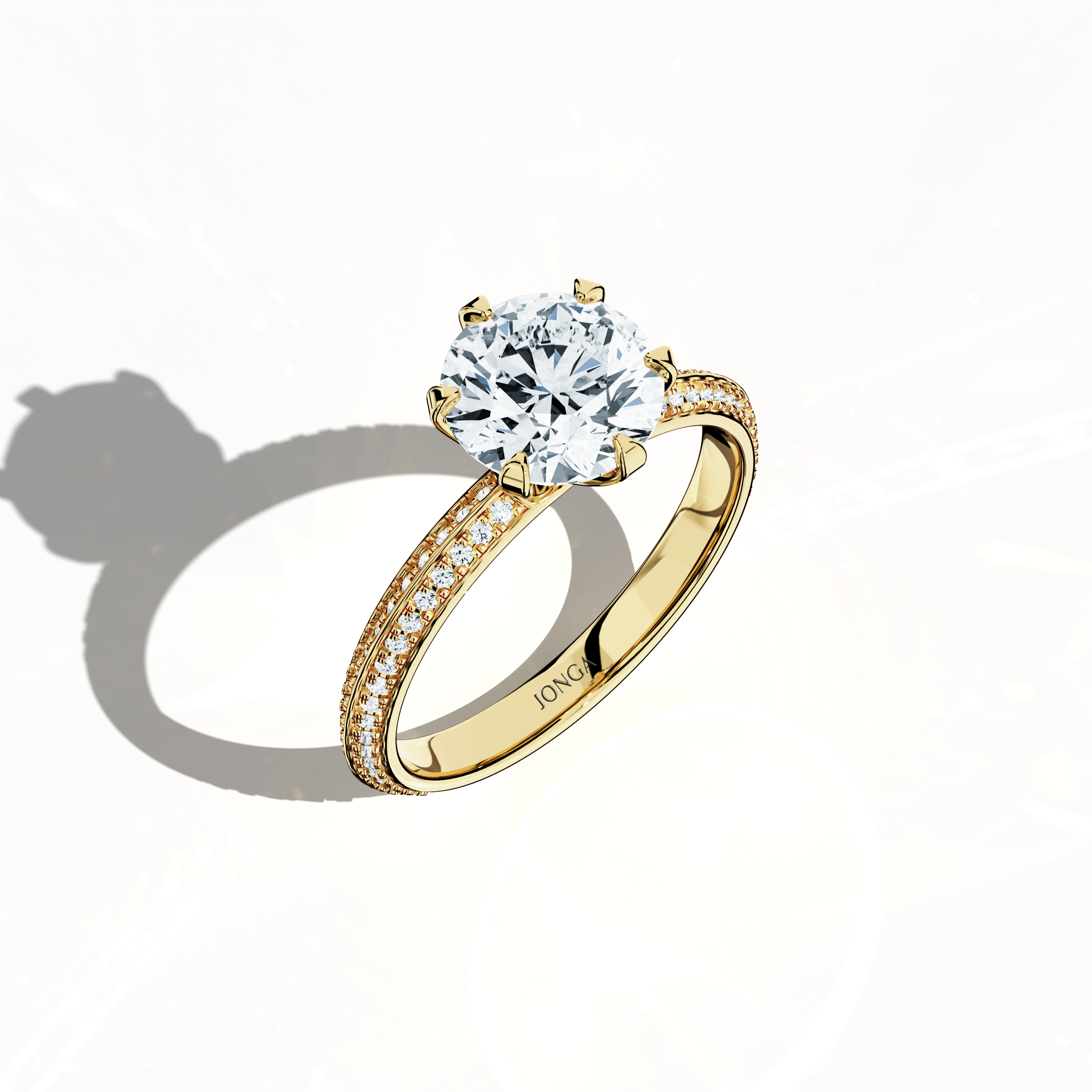 Modern 2.40 ct solitaire paved ring with a 2 ct center diamond and 0.40 ct pavé side stones, set in a classic yellow gold band with a dual‑tier, step‑designed band and a defined central line. Captured from a front top side angle, this fine jewelry/fine jewellery ring emphasizes its refined pavé setting and warm, vibrant allure.