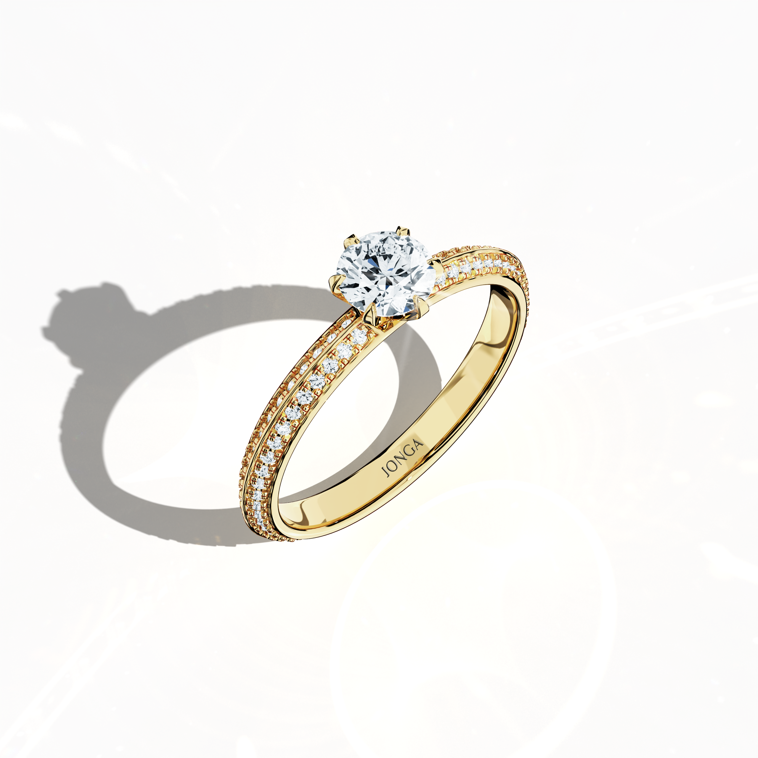 Modern 0.90 ct solitaire paved ring featuring a 0.50 ct center diamond and 0.40 ct pavé side stones, set in a classic yellow gold band with a dual‑tier, step‑designed band and a defined central line. Captured from a front top side angle, this fine jewelry/fine jewellery ring emphasizes its refined pavé setting and warm, radiant allure.
