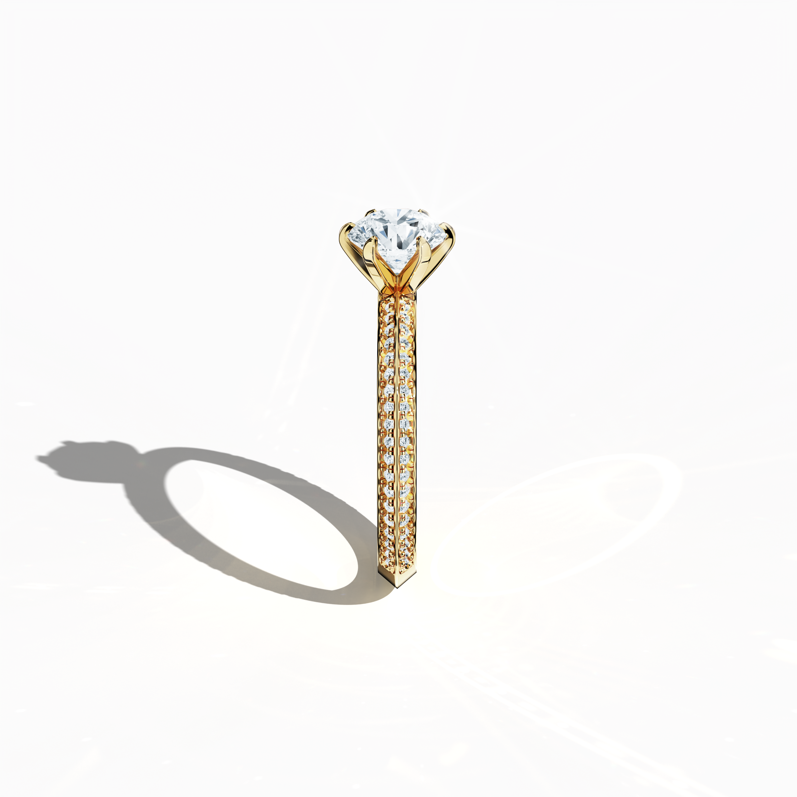 Refined solitaire paved ring with 1.40 ct diamonds – a 1 ct center stone and 0.40 ct pavé side stones – set in rich yellow gold with a two‑step band featuring a sharp central accent. Photographed from a standing side view, this fine jewelry/fine jewellery ring showcases elegant contours and vibrant, warm allure.