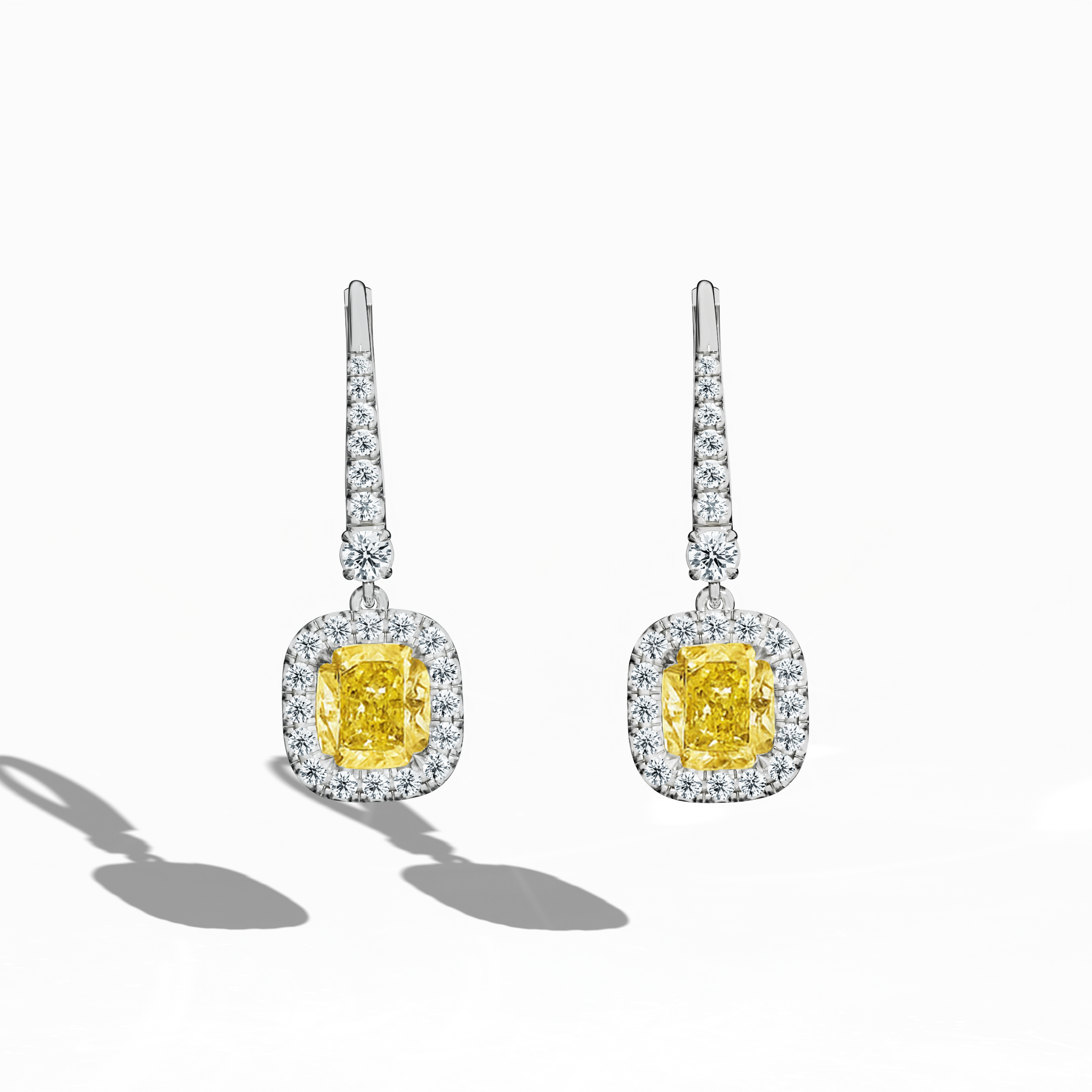 Yellow Cushion Halo Earring showing 1.00 carat cushion cut yellow diamonds with halo setting by Jonga 18K white gold
