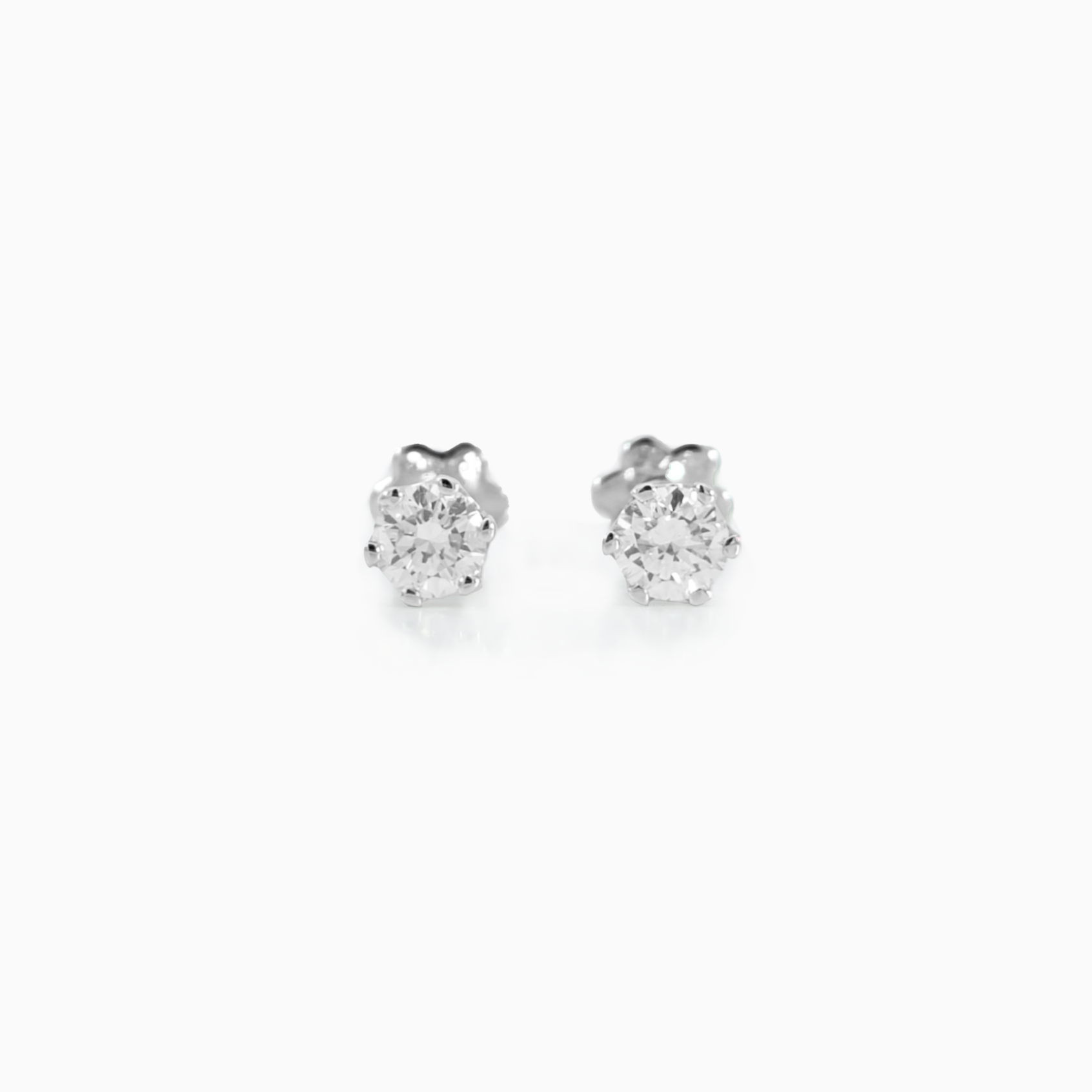 Classic Studs Med Size 0.22 carat total diamond D-F color VS clarity 18K white gold handcrafted in Dubai
