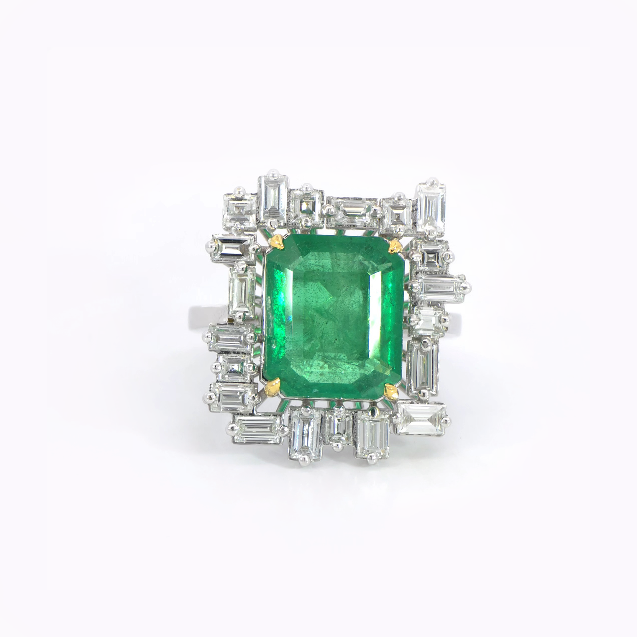 Green Emerald with tapered baguette halo ring 6.32 carat IGI certified Zambian emerald 1.67 carat diamonds D-F color VVS clarity 18K white gold Dubai
