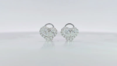 Heart shaped pear diamond halo Earring detailed video displaying heart halo setting and 0.84 carat side diamonds
